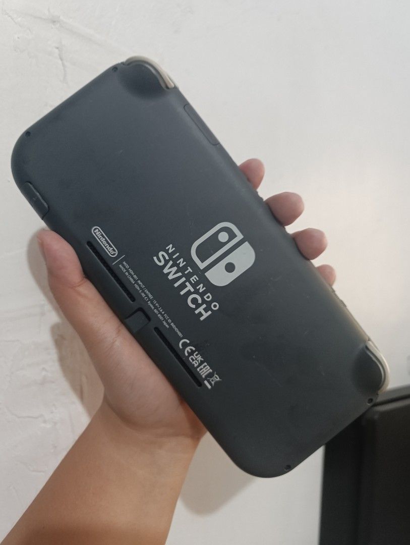 Nintendo Switch Lite Handheld Console Gray (Category: Nintendo) located in Manila. Submitted by cedieleen (Listing ID 1470457053, Image 3). Description: - Model: Nintendo Switch Lite (Matte Dark Gray) - Condition: Fully working and tested - Screen: Clear display (shown in photos) - Controls: Standard D-pad and thumbsticks installed - Features: Compact and portable handheld gaming system - Inclusions: Console only, ready for use.