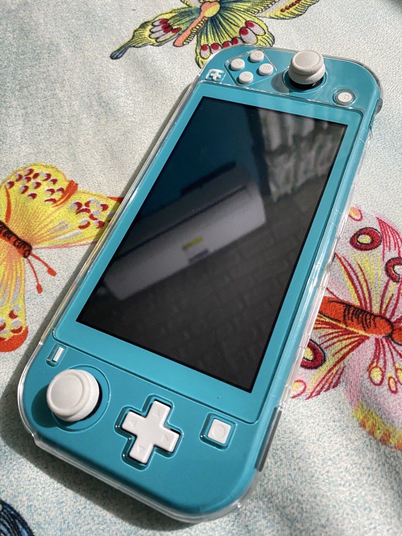 Nintendo Switch Lite Turquoise (Category: Nintendo) located in General Trias. Submitted by eddd14 (Listing ID 1470504771, Image 2). Description: For Sale Nintendo Switch Lite Turquoise No Issue, No dents Like New ✨ Nintendo Switch Lite Original Charger Storage Carrying Case Joystick Thumb Grip Protective Case Dobe Wireless Controller (Like New) Price: ₱7,000 (fixed price) Location: General Trias, Cavite.