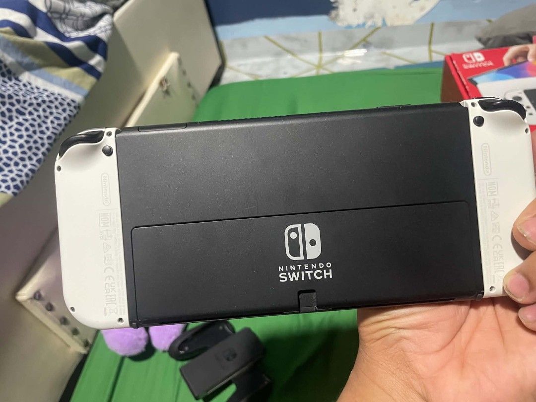 Nintendo Switch Oled (Category: Nintendo) located in Cabuyao City. Submitted by limpaywong (Listing ID 1470521729, Image 2). Description: FOR SALE Nintendo Switch OLED White Complete with box and accessories. may slight at minimal scratches, normal for 2nd hand. Goods na goods pa rin, complete with box and accessories, at naka-tempered na rin since day 1. INCLUSIONS: •Nintendo Switch Box (Serial Matched) •Nintendo Switch Unit •Original Pair of Sw