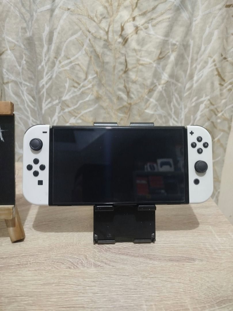 Nintendo Switch OLED mura lng! (Category: Nintendo) located in Paranaque City. Submitted by thebiskwitcompany (Listing ID 1470360844, Image 3). Description: #200 Nintendo Switch Oled P10495 -Unit, Charger, Joycons, Joycon Strap, Joycon Grip, Dock, HMDI -No Issue (buttons, analog, eshop, micro sd card reader, wifi etc) -with tempered glass since day 1 -very good condition! Shipping through Lalamove, Grab, JNT, LBC (COD/COP) Pickup @ 4th Estate Par