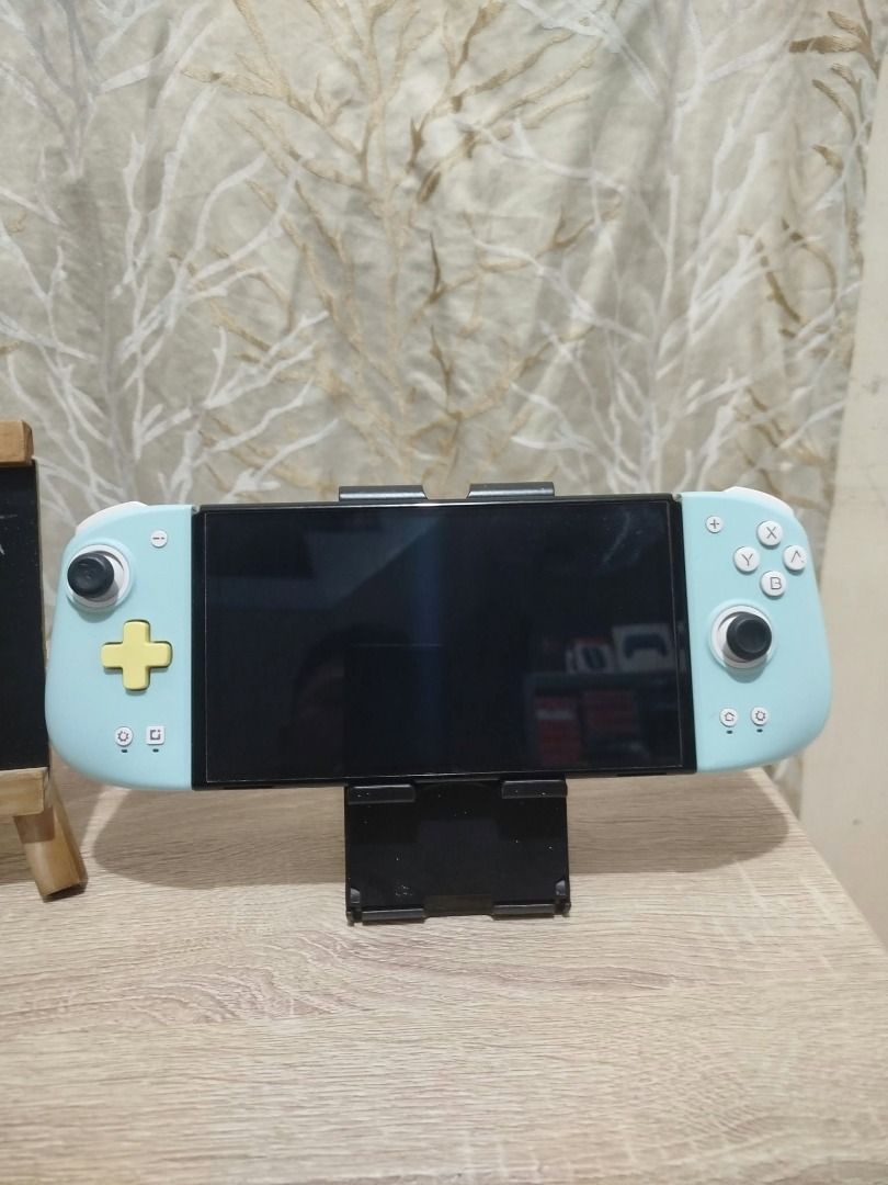 Nintendo Switch OLED with Mobapad Joy-Cons (Category: Nintendo) located in Paranaque City. Submitted by thebiskwitcompany (Listing ID 1470362838, Image 2). Description: #199 Nintendo Switch Oled P7995 -Unit, Mobapad Joycon and Charger only -No Issue (buttons, analog, eshop, micro sd card reader, wifi etc) -with tempered glass since day 1 -very good condition! Shipping through Lalamove, Grab, JNT, LBC (COD/COP) Pickup @ 4th Estate Paranaque waze: 