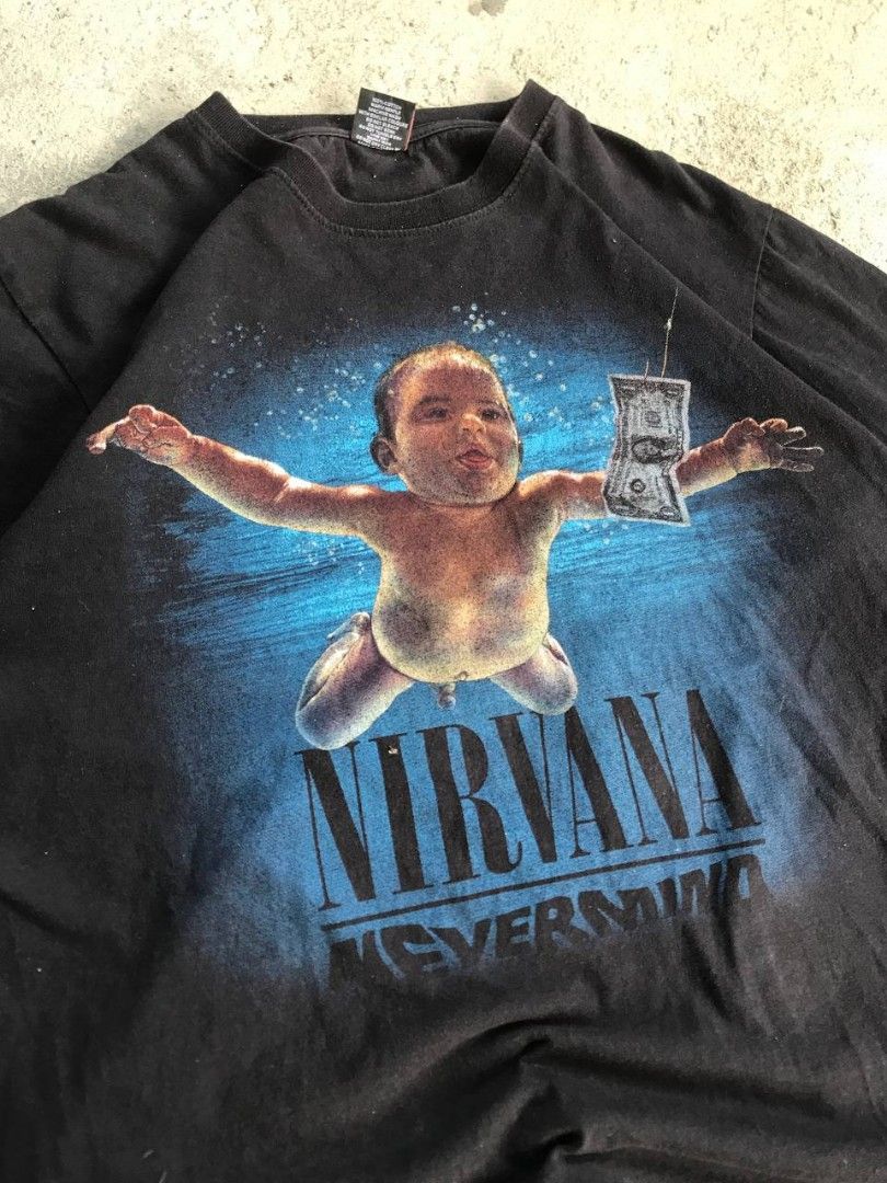 Nirvana Nevermind Graphic T-shirt Black (Category: Tshirts & Polo Shirts ) located in Bayambang. Submitted by marvinarenasph (Listing ID 1470390106, Image 3). Description: Nirvana Nevermind For size Large flat dimes: 22x28 For Vintage Wear No Side Stitching color Rate: 9.5/10 Price: 550 📍Location Bautista Pangasinan.