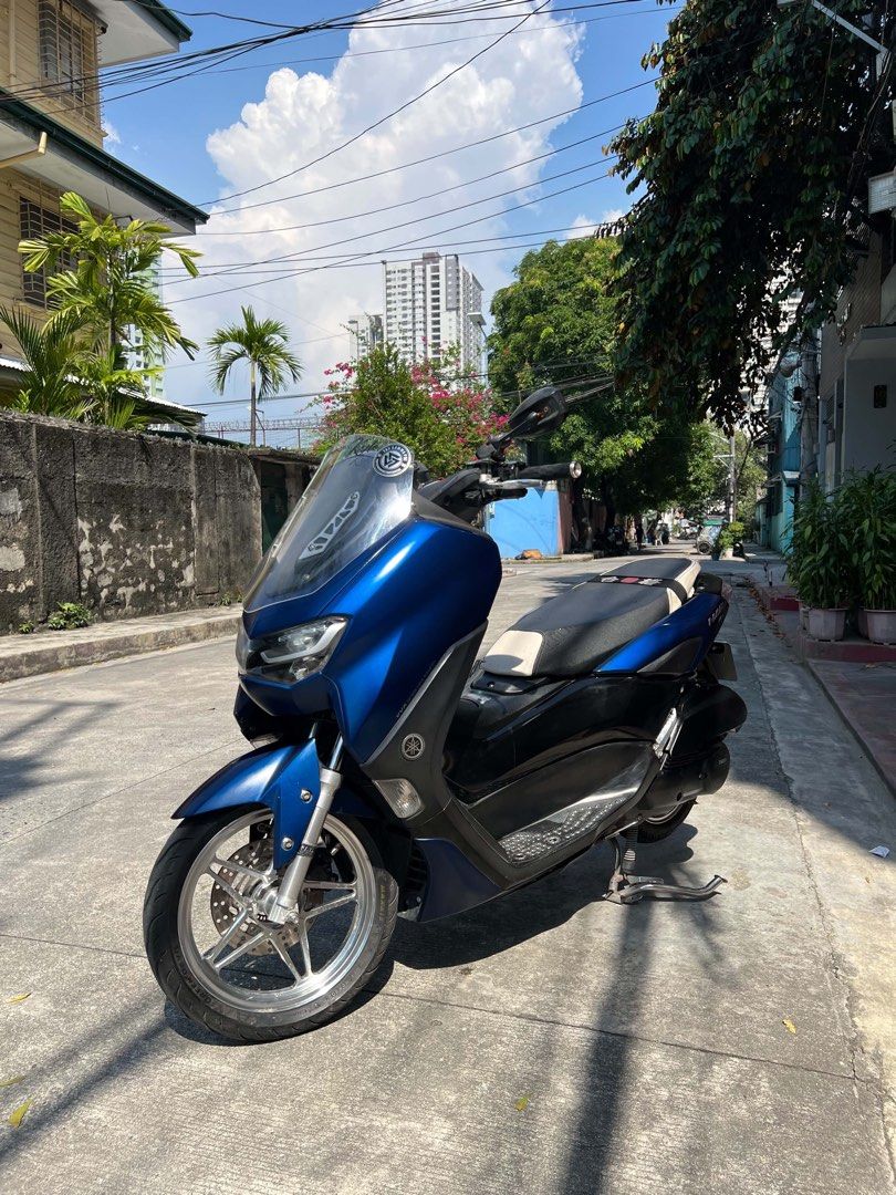 Nmax V2 2021 (Category: Motorbikes for Sale) located in Manila. Submitted by jissale (Listing ID 1470360086, Image 3). Description: WALA NA PARKINGAN BENTA NALANG🥲 NMAX V2 2021 NON ABS Price: 85K NALANG‼️ Original OR CR Open Dos Unregistered aug 2026 May plaka from LTO Color indicated White bolts 80% BomX Mags with Big Disc Rcb caliber lever Clear visor Mt8 pipe Makapal mga gulong Rcb Shock Brb radiator Makinis fairings NO ISSUE NO ISSUE Locatio