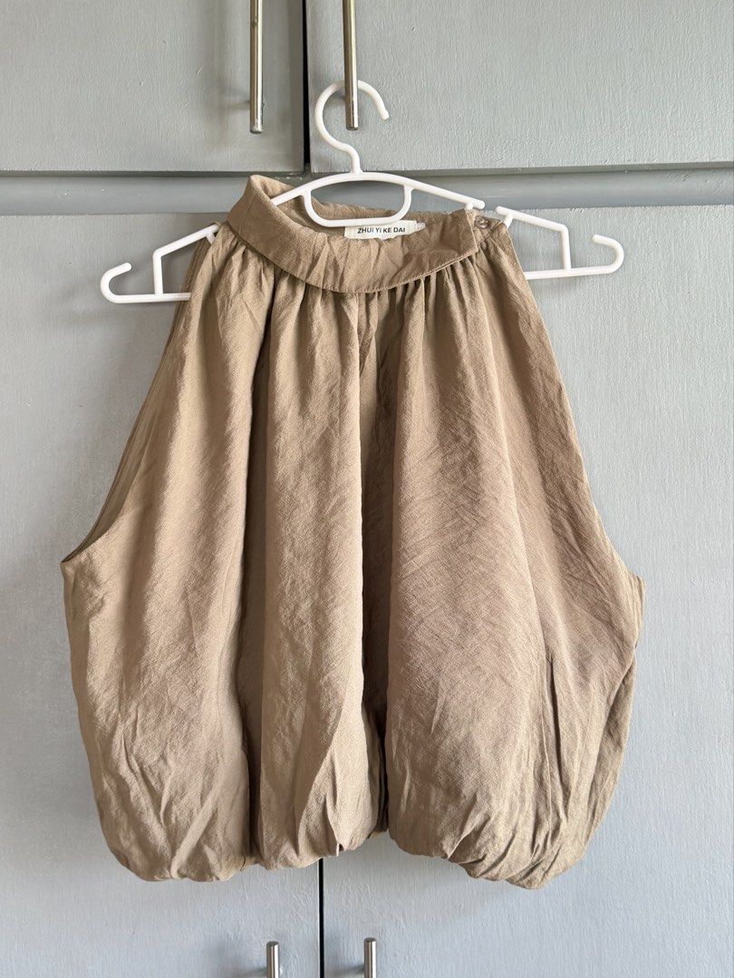 Nude/Beige Bubble Hem Halter Top (Category: Sleeveless) located in San Juan City. Submitted by itemsfromkam (Listing ID 1470454911, Image 1). Description: • L on tag, fits S-semi L • unique style, has inner lining, vv cute! • great for dinners and night outs • actual ww at the end.