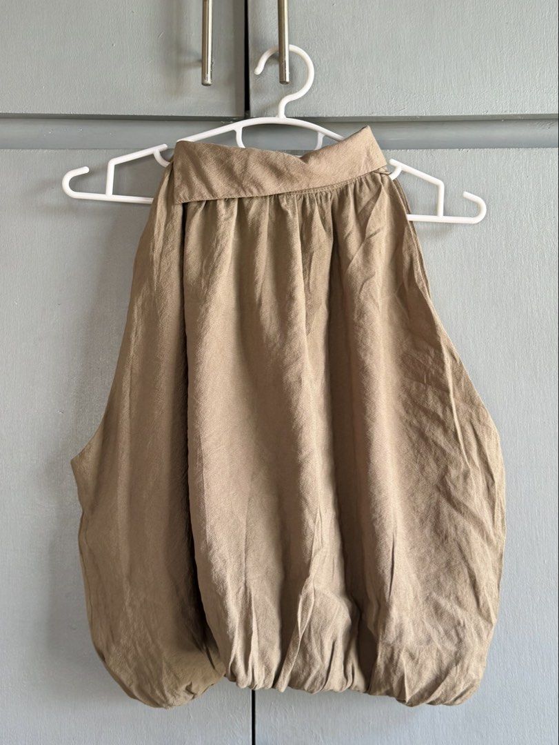 Nude/Beige Bubble Hem Halter Top (Category: Sleeveless) located in San Juan City. Submitted by itemsfromkam (Listing ID 1470454911, Image 2). Description: • L on tag, fits S-semi L • unique style, has inner lining, vv cute! • great for dinners and night outs • actual ww at the end.