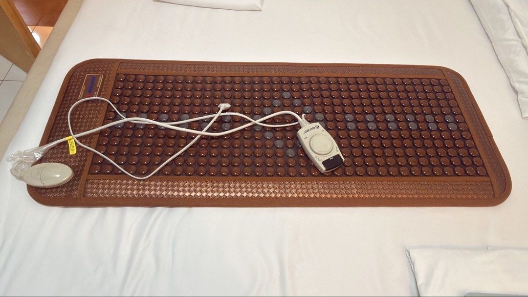Nuga Best Thermal Massage Bed with Accessories (Category: Massage Devices) located in Santa Rosa. Submitted by sprutus (Listing ID 1470464135, Image 2). Description: - Authentic Nuga Best thermal massage bed in brown and white - Includes tourmaline stone mats, handheld massagers, and low frequency device - Comes with standing unit, all cables, and remotes - Fully adjustable setup in great working condition - Clean upholstery throughout - Note: He