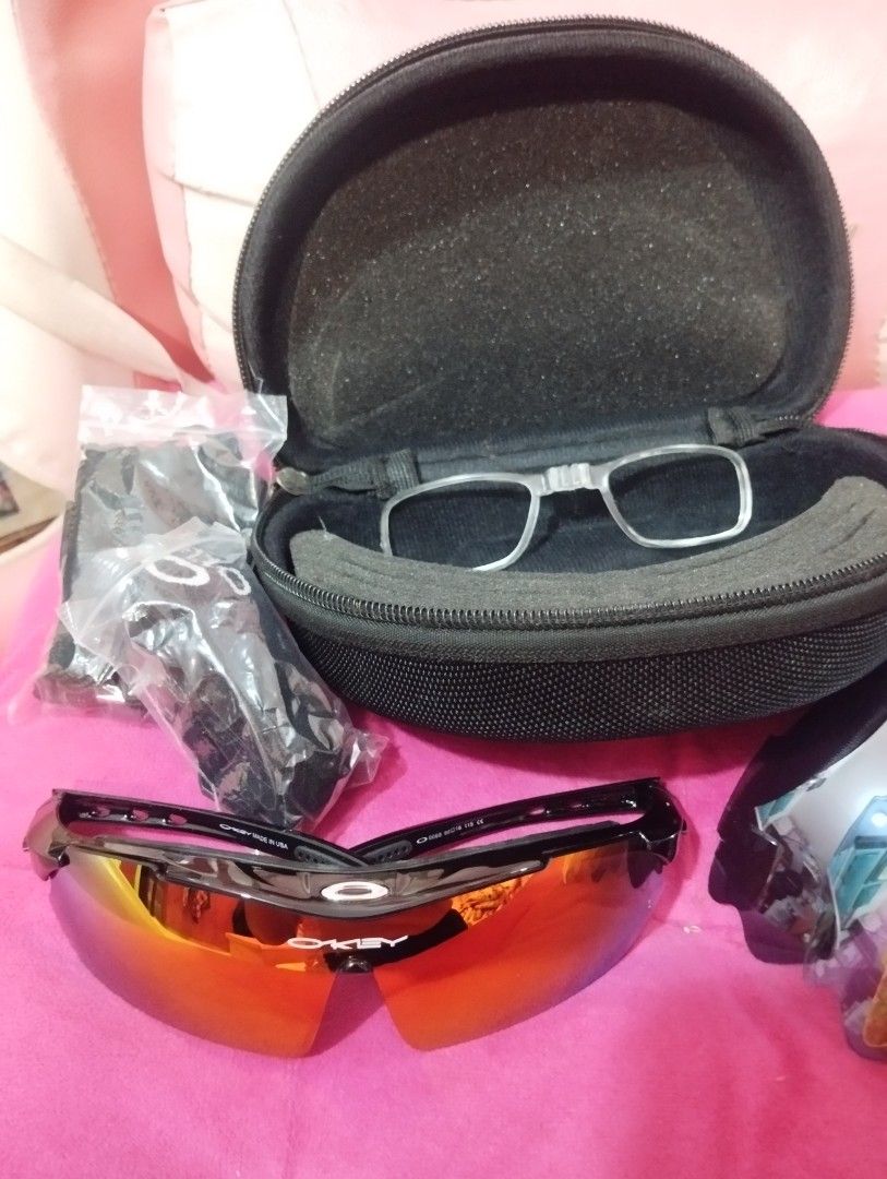 Oakley Hard Shell Sunglasses Case with Genuine Software Tag (Category: Sunglasses & Eyewear) located in Taguig. Submitted by blairescloset (Listing ID 1470474037, Image 2). Description: - Authentic black hard shell case for Oakley sunglasses - Durable textured fabric exterior with the iconic Oakley oval logo - Features the signature grey 'Genuine Software' woven fabric label - Smooth and reliable zipper closure - Sturdy built to protect your shad