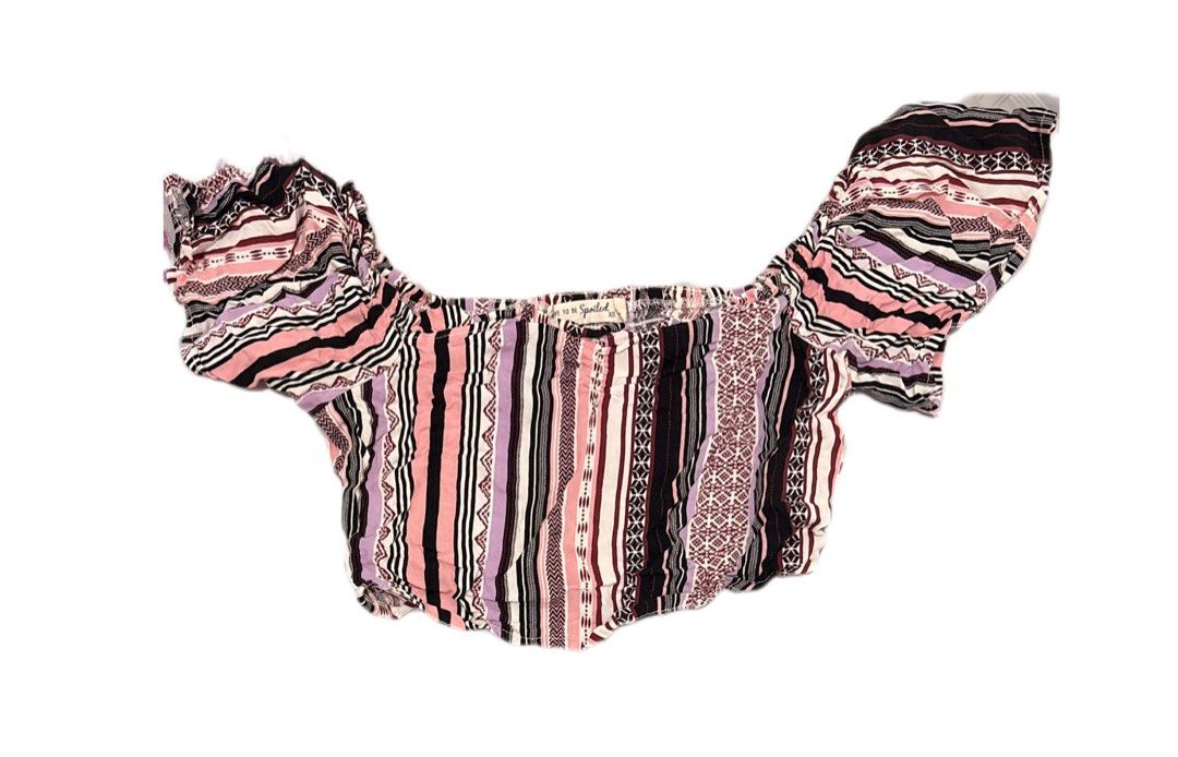 Off-Shoulder Crop Top Striped XS (Category: Blouses) located in Manila. Submitted by areiei (Listing ID 1470366092, Image 1). Description: - Brand: Live to be Spoiled - Size: XS - Color/Pattern: Pink, black, purple, and white vertical stripes - Style: Off-shoulder crop top with short ruffled sleeves and elastic neckline - Fabric: Lightweight and breathable for warm weather - Versatility: Pairs easily with high-waisted shorts or jeans - Condition: