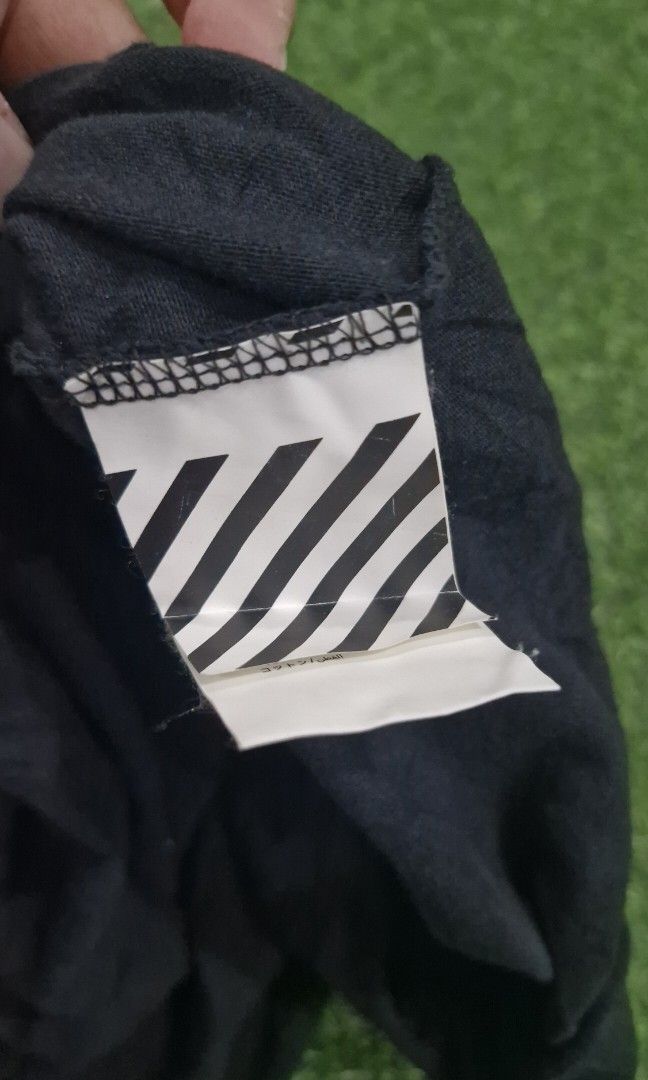Off-White Black Flames In Hands T-Shirt (Category: Tshirts & Polo Shirts ) located in Pili. Submitted by the_g_thrift (Listing ID 1470468564, Image 3). Description: Off-White Black Flames In Hands T-Shirt size medium on tag dimes: 20 x 29 very good condition issue minimal na bakbak sa print dumikit kasi as as new sana single stitch.