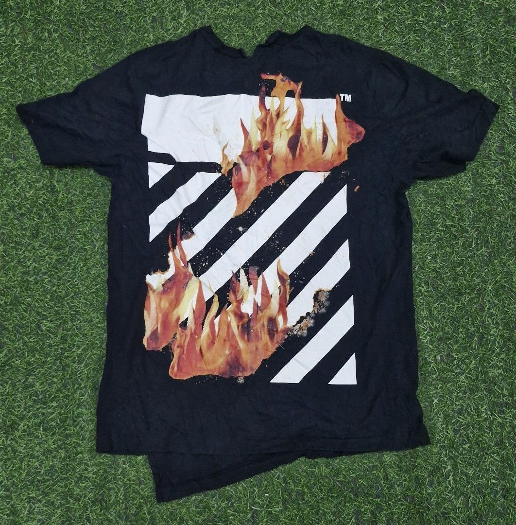 Off-White Black Flames In Hands T-Shirt (Category: Tshirts & Polo Shirts ) located in Pili. Submitted by the_g_thrift (Listing ID 1470468564, Image 2). Description: Off-White Black Flames In Hands T-Shirt size medium on tag dimes: 20 x 29 very good condition issue minimal na bakbak sa print dumikit kasi as as new sana single stitch.