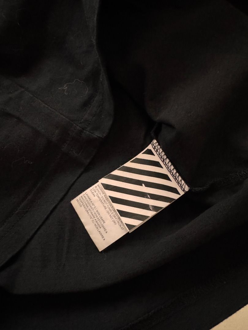Off-White Impressionism '99 Black T-Shirt M (Category: Shirts) located in Cebu City. Submitted by _t.rix (Listing ID 1470373936, Image 3). Description: - Authentic Off-White short sleeve tee from the Impressionism collection - Color: Black - Features '99' print and graphic on the chest - Large eye-catching graphic and text on the back - Classic crew neck style with a regular fit - Made in Portugal - Interior wash tags and main label intact.