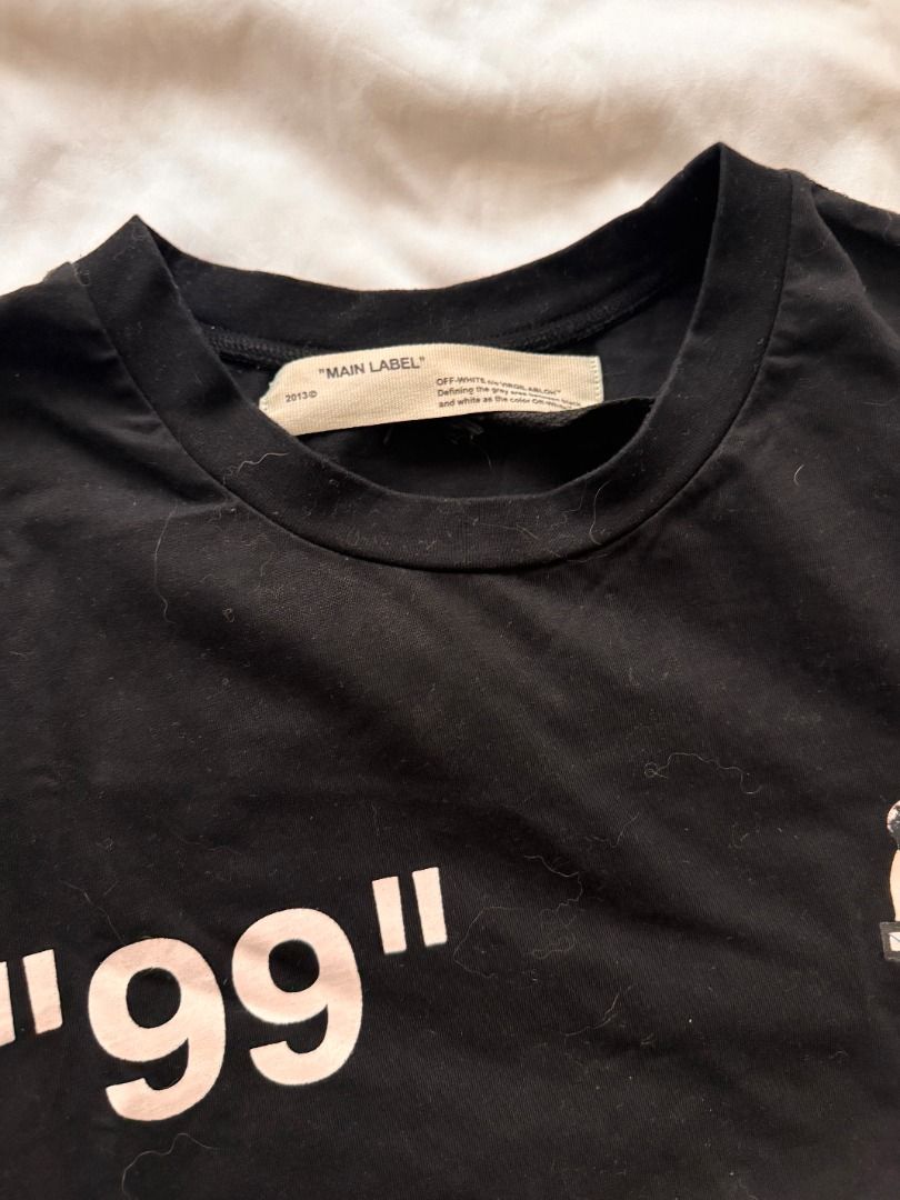 Off-White Impressionism '99 Black T-Shirt M (Category: Shirts) located in Cebu City. Submitted by _t.rix (Listing ID 1470373936, Image 2). Description: - Authentic Off-White short sleeve tee from the Impressionism collection - Color: Black - Features '99' print and graphic on the chest - Large eye-catching graphic and text on the back - Classic crew neck style with a regular fit - Made in Portugal - Interior wash tags and main label intact.