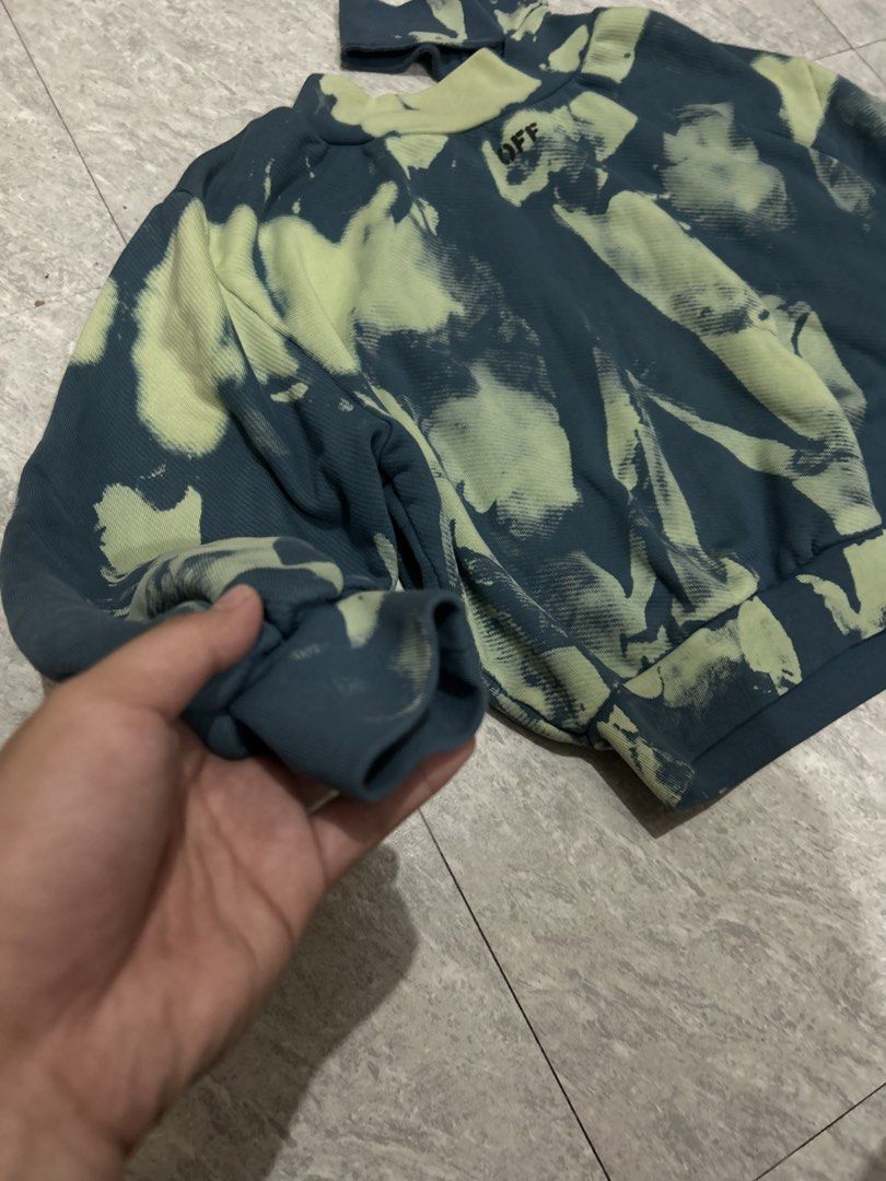 Off-White Tie-Dye Mock Neck Sweatshirt (Category: Longsleeves) located in Manila. Submitted by tanieel (Listing ID 1470461770, Image 3). Description: - Brand: Off-White - Style: Tie-dye sweatshirt in blue and green - Neckline: Mock neck with small 'OFF' print - Details: Long sleeves, ribbed cuffs and hem - Interior: Soft French terry lining - Condition: Brand new with main label tag attached via plastic fastener.