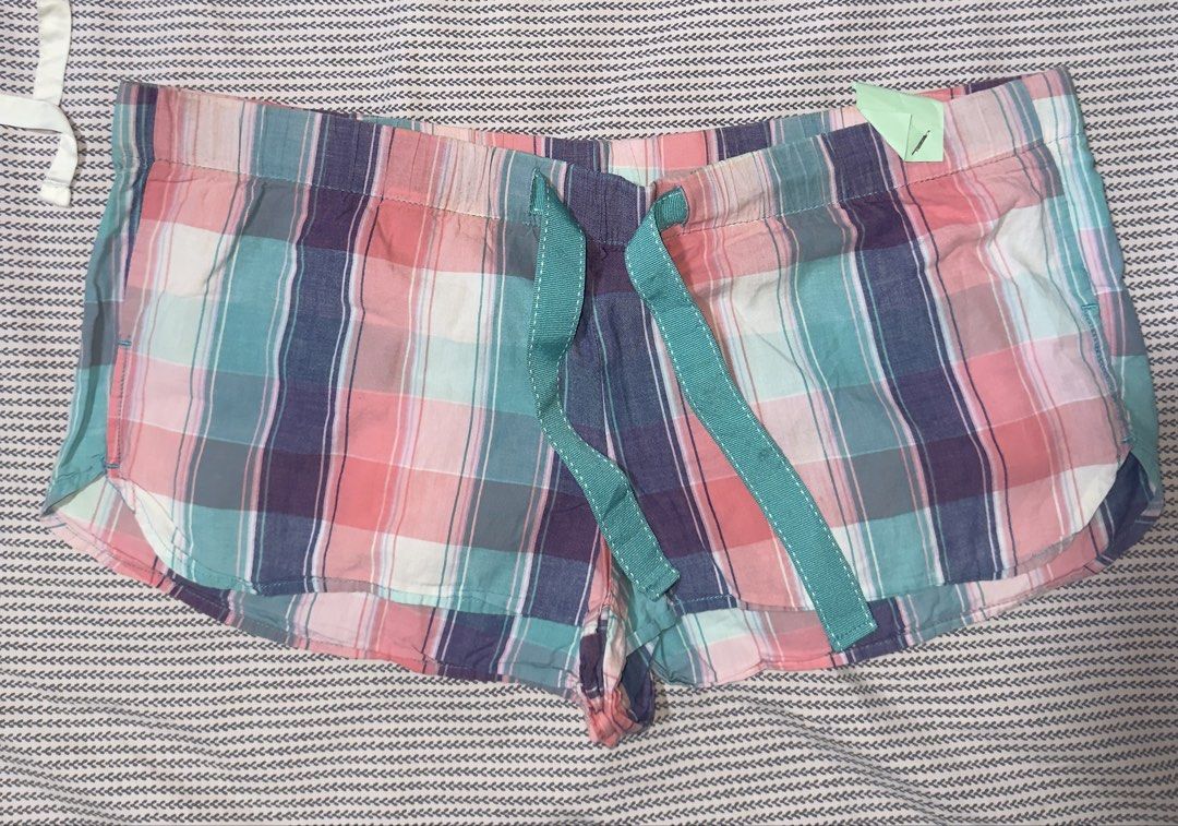 Old Navy Plaid Pajama Shorts Medium (Category: Shorts) located in Santa Ana. Submitted by fatikilla (Listing ID 1470365036, Image 1). Description: - Brand: Old Navy - Item: Plaid pajama shorts (Pink, Teal, Navy Blue) - Size: Medium - Material: Lightweight cotton - Features: Elastic waistband with teal drawstring, curved side hems - Condition: Great for sleeping and lounging.