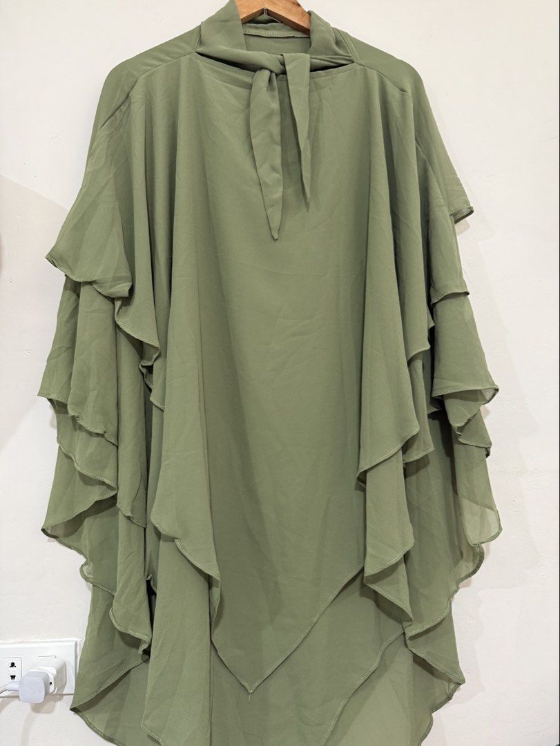 Olive green cover up shawl (Category: Coats, Jackets and Outerwear) located in Manila. Submitted by morningthrifters (Listing ID 1470477458, Image 2). Description: 📝This garment is a multi-layered chiffon (an elegant, flowy head and upper-body covering designed for modest dress), which can be worn beautifully as an overlay with simple abayas, inner slip dresses, or formal evening gowns. 📐Free size 💗 Second time buyers has a free item, follow m