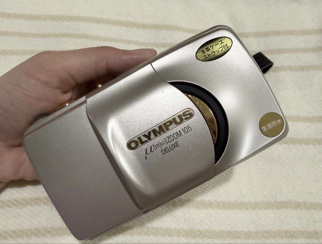 OLYMPUS MJU ZOOM 105 DELUXE (Category: Cameras) located in Caloocan City. Submitted by shopsnapkookie (Listing ID 1470353134, Image 1). Description: 📸 FILM CAMERA 📸 OLYMPUS MJU ZOOM 105 DELUXE with remote control for self-timer 🏷️Price: ₱7,000 🎞️ Automatic 35mm compact point-and- shoot camera 🎞️ Flash: Auto. Red-eve reduction. Fill-in ✅ Condition: 9.5/10, few scratches ✅ Clean Lens and viewfinder ✅ Working Flash, Zoom, Remote control for sel