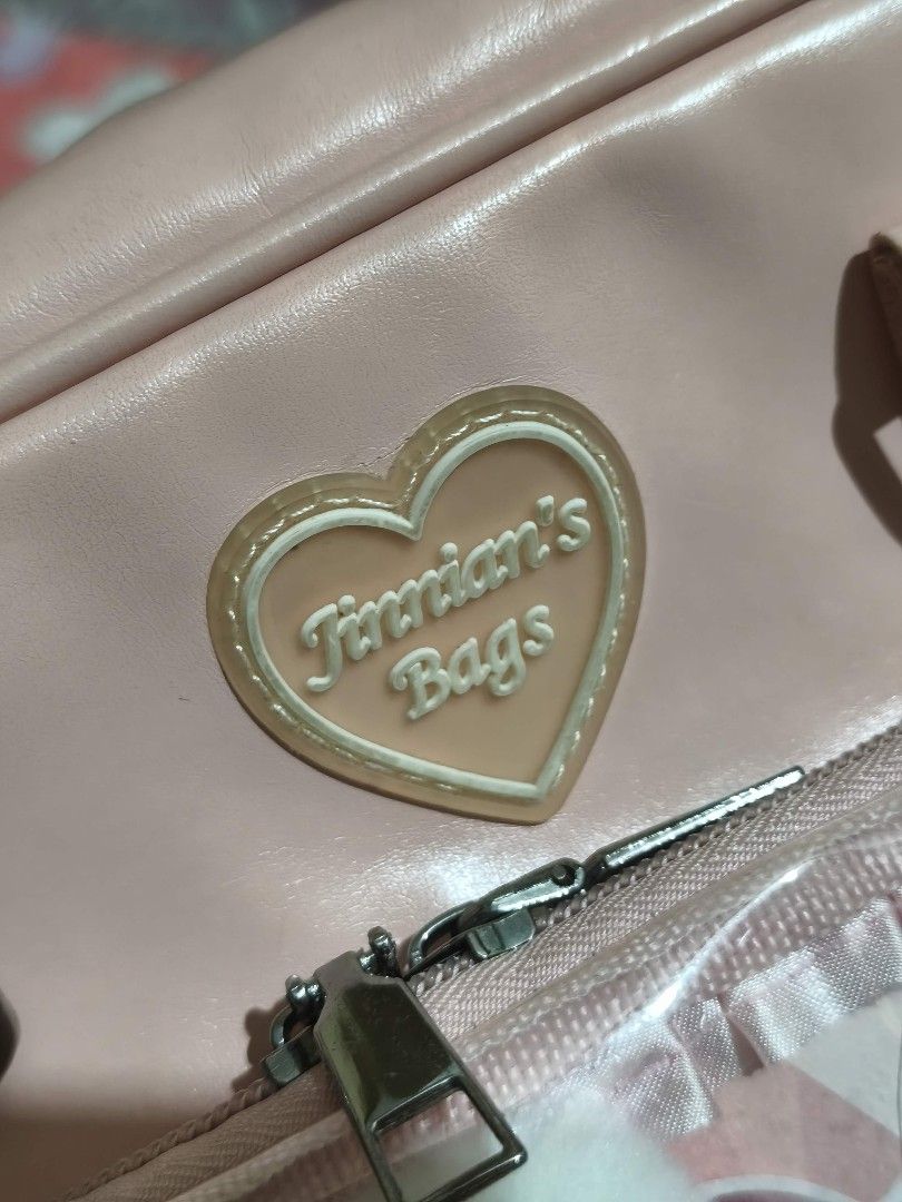 ON HAND | Pink Ita Bag (Category: Shoulder Bags) located in Quezon City. Submitted by mizirubii (Listing ID 1470511938, Image 2). Description: [PLEASE READ FIRST!] ₍^. .^₎⟆ #woobysells .ᐟ ₊˚⊹ Pink Ita Bag ₱500 ✧ Merch not included but design is included ✧ Includes shoulder strap and longer bag strap, has 1 zipper pocket and 2 small pockets inside ✧ No to sensitive/impatient ✧ Honest flaw: logo became yellowish, some small stains and leather chipp