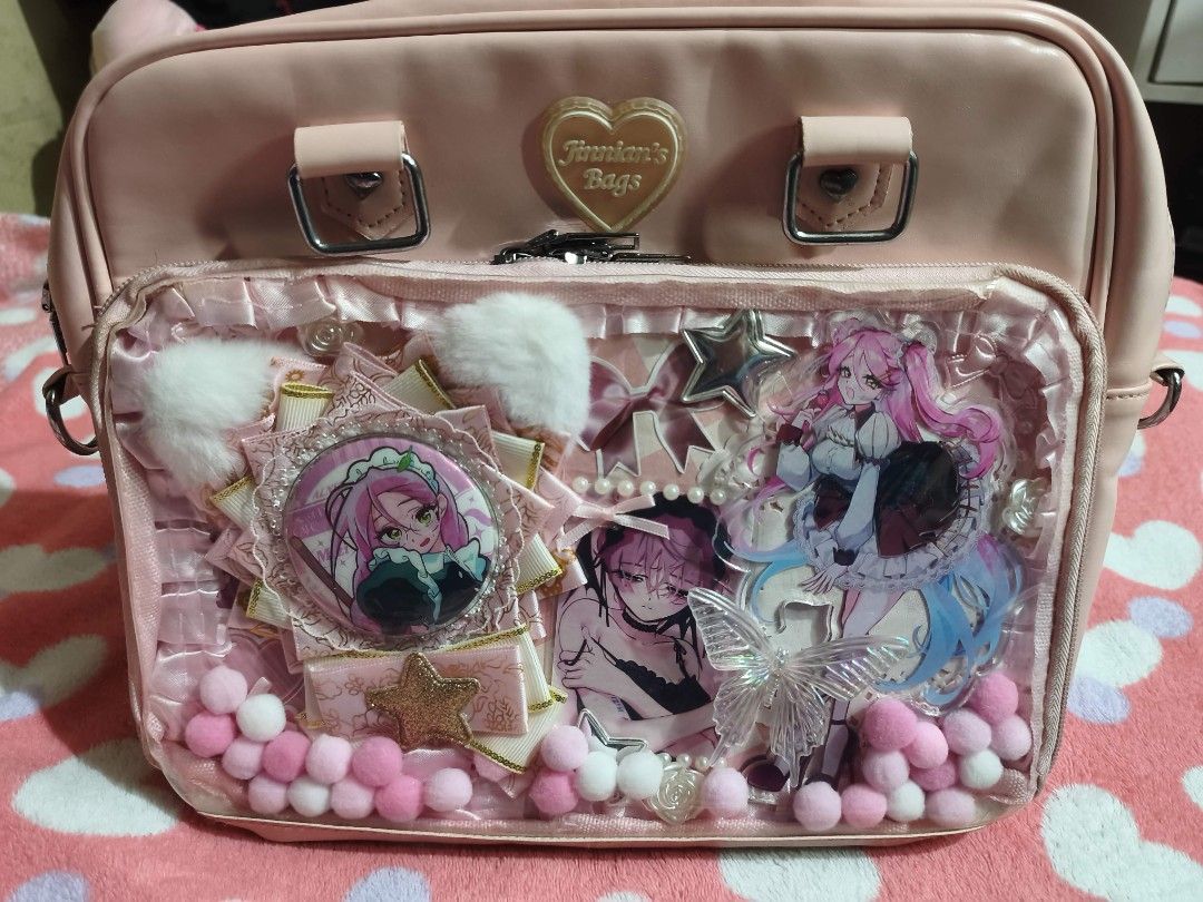 ON HAND | Pink Ita Bag (Category: Shoulder Bags) located in Quezon City. Submitted by mizirubii (Listing ID 1470511938, Image 1). Description: [PLEASE READ FIRST!] ₍^. .^₎⟆ #woobysells .ᐟ ₊˚⊹ Pink Ita Bag ₱500 ✧ Merch not included but design is included ✧ Includes shoulder strap and longer bag strap, has 1 zipper pocket and 2 small pockets inside ✧ No to sensitive/impatient ✧ Honest flaw: logo became yellowish, some small stains and leather chipp