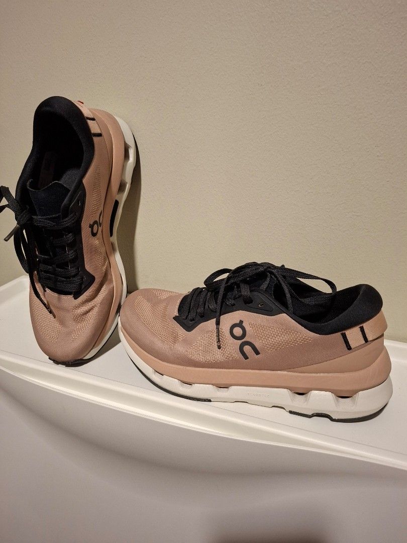 On Running Cloudtilt Sneakers (Category: Sneakers) located in Manila. Submitted by olxph_181341877 (Listing ID 1470353159, Image 2). Description: - SPECIAL OFFER P15K FOR 2 PAIRS Brand: On Running Cloudtilt - Quantity: 2 pairs available - Colorway 1: Pearl ivory with maroon accents (Year of the Snake collection) - Colorway 2: Bronze brown and black - Features: Lightweight mesh upper and cushioned sole with CloudTec Phase technology - Condition: S