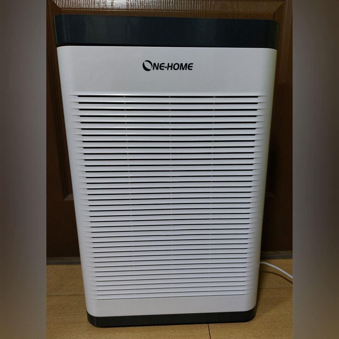 ONE-HOME Air Purifier (K15 Ultra) (Category: Air Purifiers & Dehumidifiers) located in Pasig City. Submitted by keithra (Listing ID 1470546542, Image 1). Description: - Brand: ONE-HOME - Color: White body with dark gray top and accents - Display: Digital control panel showing PM2.5 levels, temperature, fan speed, and mode - Controls: Touch buttons for power, speed, timer, sterilization, and anion - Design: Front slatted intake grille, side handle
