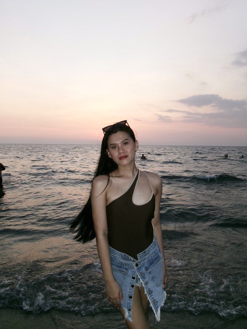 One-shoulder brown and beige swimsuit (Category: Bikinis & Swimsuits) located in Makati City. Submitted by lemoneyeddd (Listing ID 1470502201, Image 1). Description: - Style: One-piece swimsuit with an asymmetrical neckline - Details: Contrast beige trim on shoulder strap and cutout - Condition: Worn once for beach photos, freshly washed and clean - Styling Tip: Looks amazing paired with denim shorts - Perfect for: Beach trips, pool days, and vac