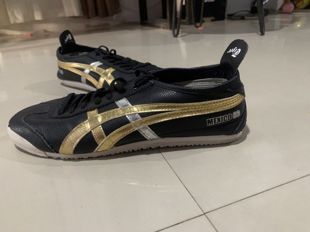 Onitsuka Tiger Mexico 66 Black Gold Silver (Category: Sneakers) located in Bulacan. Submitted by furnituresantamariabulacan (Listing ID 1470439726, Image 1). Description: Good as new No dragging Sa tiles ng mall at kotse lang nakatapak Size 10US Malaki sakin 9.5us lang ako. 3times lang nagamit - Brand: Onitsuka Tiger Mexico 66 - Color/Design: Black leather upper with iconic gold and silver stripes - Soles: White rubber outsoles with great tread f