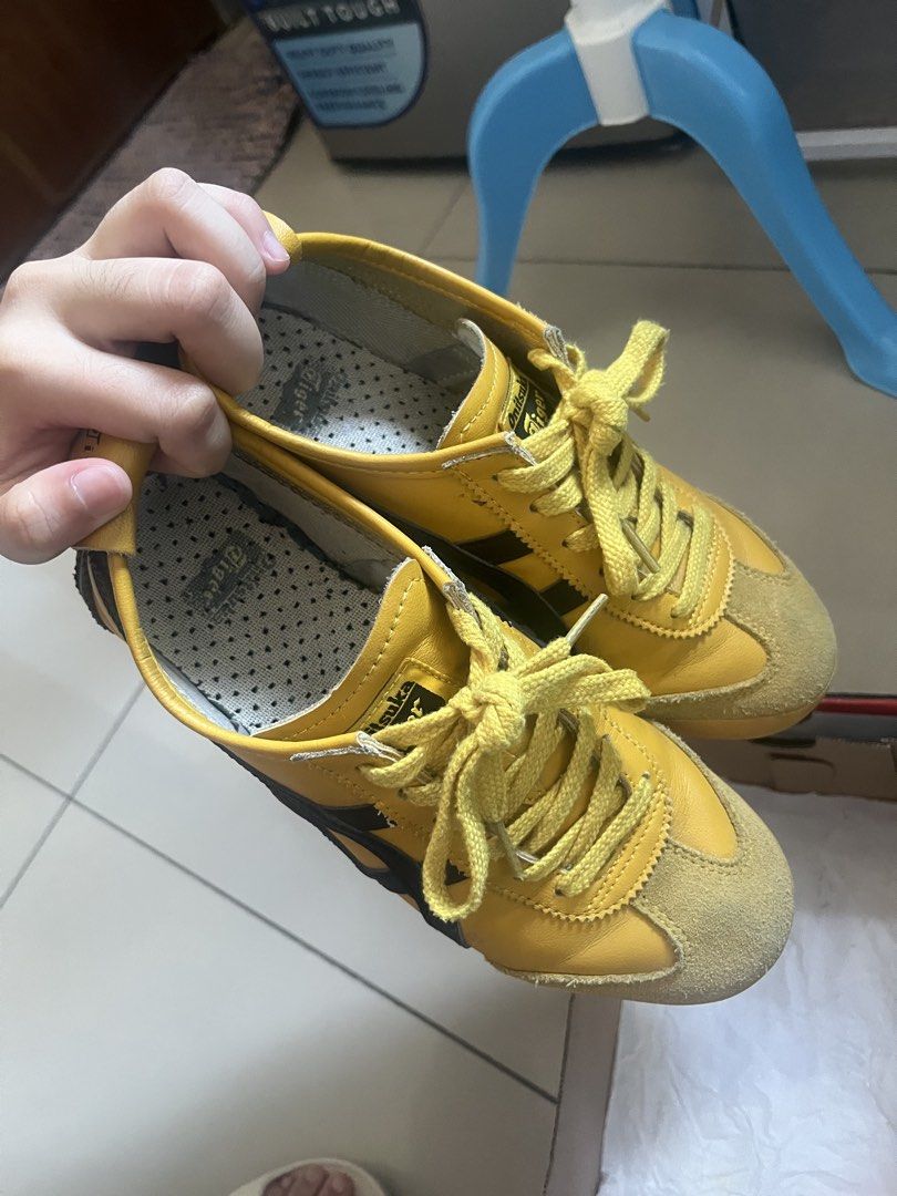 Onitsuka Tiger Yellow Black Sneakers with Box (Category: Sneakers) located in Manila. Submitted by dane.1018 (Listing ID 1470391663, Image 2). Description: - Brand: Onitsuka Tiger - Color: Iconic Yellow and Black - Style: Low-top sneakers - Details: Suede toe cap and heel counter - Comfort & Grip: Perforated insoles and textured rubber outsoles with great traction - Inclusions: Comes with original shoe box - Condition: Well-maintained and ready t