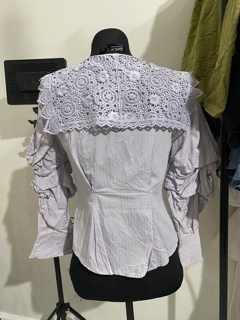 ONLY Lavender Button-Up Shirt with Lace Collar Size S (Category: Blouses) located in Manila. Submitted by mpt99876 (Listing ID 1470496312, Image 3). Description: - Brand: ONLY - Size: Small - Color: Lavender - Details: Statement crochet lace collar, unique tiered sleeve ruffles, front and cuff button closures - Fabric: Soft striped texture - Style: Versatile for casual or dressed-up wear - Condition: Great piece.