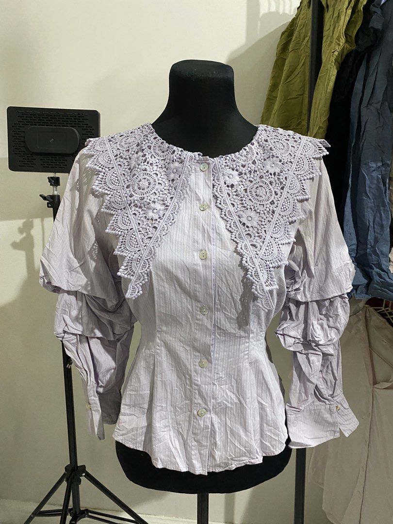 ONLY Lavender Button-Up Shirt with Lace Collar Size S (Category: Blouses) located in Manila. Submitted by mpt99876 (Listing ID 1470496312, Image 1). Description: - Brand: ONLY - Size: Small - Color: Lavender - Details: Statement crochet lace collar, unique tiered sleeve ruffles, front and cuff button closures - Fabric: Soft striped texture - Style: Versatile for casual or dressed-up wear - Condition: Great piece.