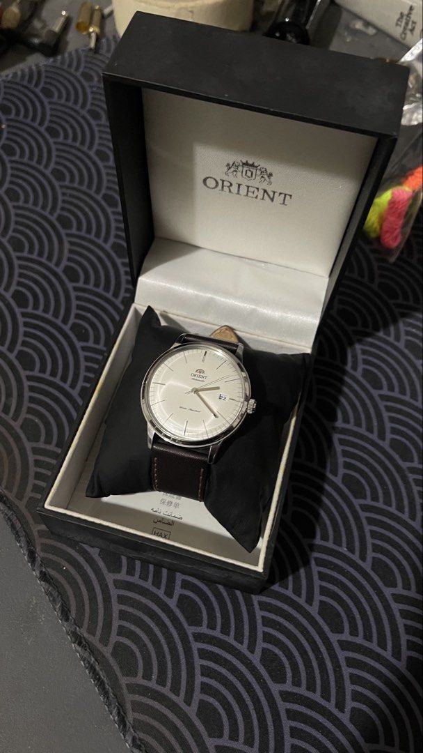 Orient Bambino Gen 2 V3 White Dial Brown Strap (Category: Men's Watches) located in Cebu City. Submitted by redd_or_yellow (Listing ID 1470531501, Image 2). Description: Orient Bambino Gen 2 V3 FACOOOOEWO ACO00OEW White Dial Minimalist 40.5 mm with Brown Strap. Comes with Box and Card Add ons: Black Aftermarket Leather Strap.