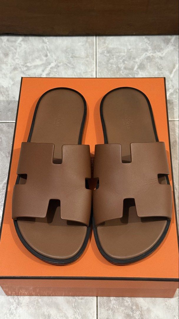 ORIGINAL Hermes Izmir Sandals (Category: Slippers & Slides) located in Quezon City. Submitted by ches.declutters (Listing ID 1470527822, Image 3). Description: - 100% AUTHENTIC - Bought in Singapore - Includes original Hermes box and dust bags - Condition: 9/10 - Minor scuffs and creases, which is expected especially for footwear.