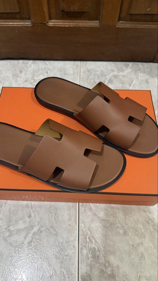 ORIGINAL Hermes Izmir Sandals (Category: Slippers & Slides) located in Quezon City. Submitted by ches.declutters (Listing ID 1470527822, Image 2). Description: - 100% AUTHENTIC - Bought in Singapore - Includes original Hermes box and dust bags - Condition: 9/10 - Minor scuffs and creases, which is expected especially for footwear.