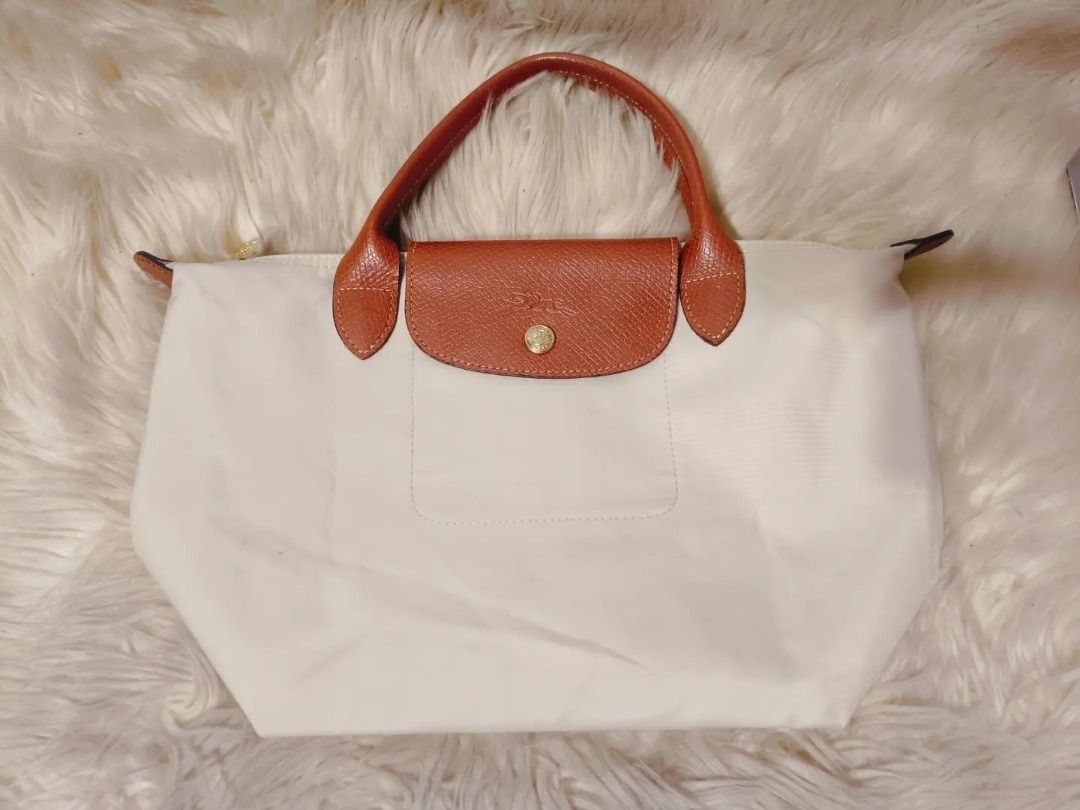 Original Longchamp SSH (Category: Shoulder Bags) located in Cabuyao City. Submitted by your____lux____shop (Listing ID 1470525171, Image 1). Description: Sale❗️Sale❗️Sale❗️ ₱ 1,699 Original LONGCHAMP Preloved Small short handle Nylon & genuine leather trim 📌First to pay!.