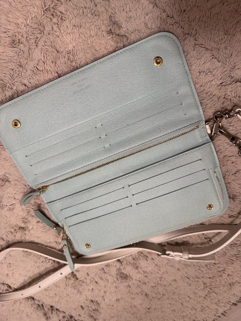 ORIGINAL Louis Vuitton Multicolor Monogram Wallet (Category: Luxury Bags & Wallets) located in Antipolo. Submitted by nathshn_ (Listing ID 1470400499, Image 2). Description: - Authentic Louis Vuitton long zip wallet - Iconic white multicolor monogram exterior - Light blue textured leather interior with card slots, coin compartment, and slip pockets - Elegant gold-tone hardware DOES NOT COME WITH STRAP AND ORIGINAL PACKAGING. .