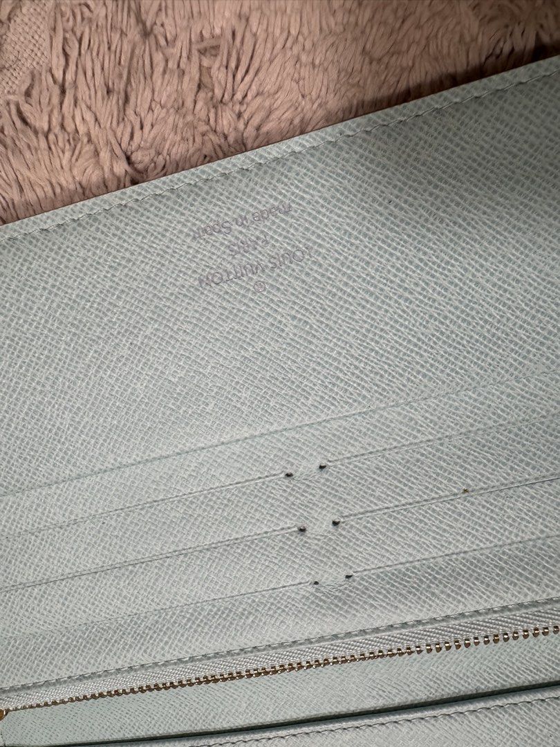 ORIGINAL Louis Vuitton Multicolor Monogram Wallet (Category: Luxury Bags & Wallets) located in Antipolo. Submitted by nathshn_ (Listing ID 1470400499, Image 3). Description: - Authentic Louis Vuitton long zip wallet - Iconic white multicolor monogram exterior - Light blue textured leather interior with card slots, coin compartment, and slip pockets - Elegant gold-tone hardware DOES NOT COME WITH STRAP AND ORIGINAL PACKAGING. .