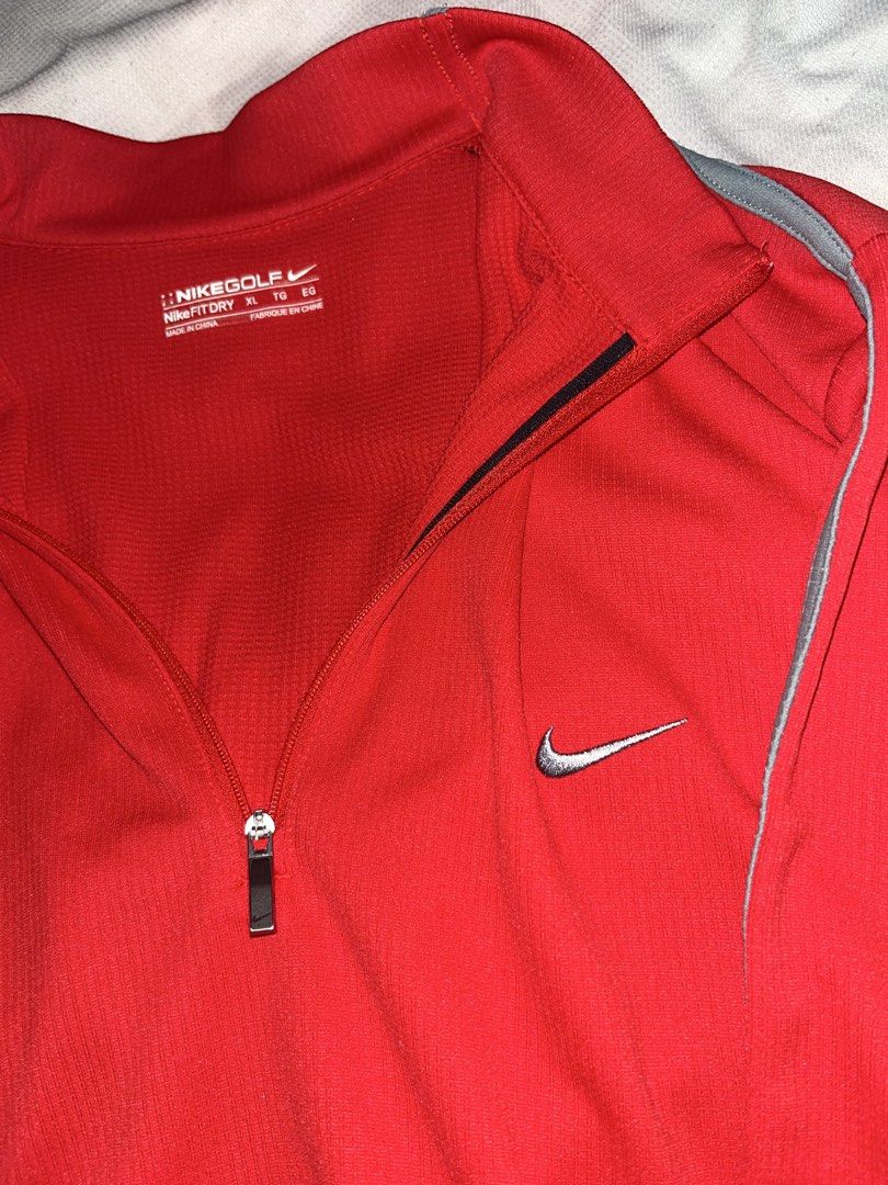 ORIGINAL Nike Golf Fit Dry Red Quarter Zip Pullover XL (Category: Coats, Jackets and Outerwear) located in Las Pinas. Submitted by yzzalouis (Listing ID 1470475833, Image 3). Description: - Brand: Nike Golf - Style: Quarter-zip pullover - Color: Bright red with grey shoulder piping - Size: XL - Material: Nike Fit Dry (keeps you cool and dry) - Details: Silver swoosh logo on the chest - Condition: no issue.
