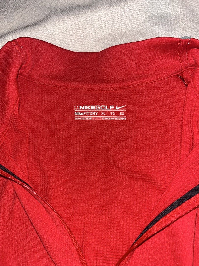 ORIGINAL Nike Golf Fit Dry Red Quarter Zip Pullover XL (Category: Coats, Jackets and Outerwear) located in Las Pinas. Submitted by yzzalouis (Listing ID 1470475833, Image 2). Description: - Brand: Nike Golf - Style: Quarter-zip pullover - Color: Bright red with grey shoulder piping - Size: XL - Material: Nike Fit Dry (keeps you cool and dry) - Details: Silver swoosh logo on the chest - Condition: no issue.