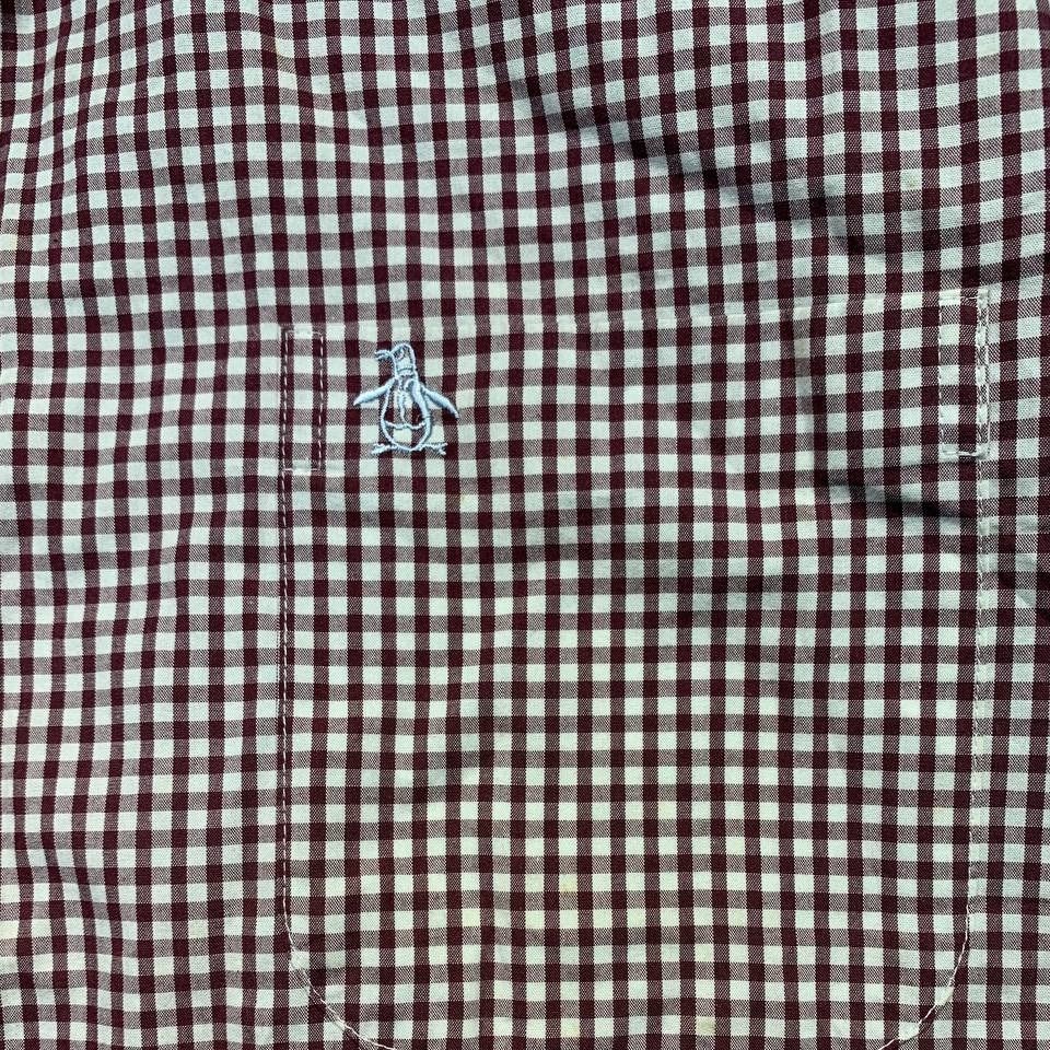Original Penguin Gingham Long Sleeve Button-Down Shirt (Category: Formal Shirts) located in Mandaluyong City. Submitted by theroom501 (Listing ID 1470521680, Image 3). Description: Original Penguin Gingham Long Sleeve Button-Down Shirt Style Code: Size on Tag:3XL Color: Red & white Condition: Good pre-owned condition with a heavily distressed vintage look. Authenticity Flaws/Issues: Yellow Stain. Flat Lay Measurements: Pit to Pit: 31 inches Lengt
