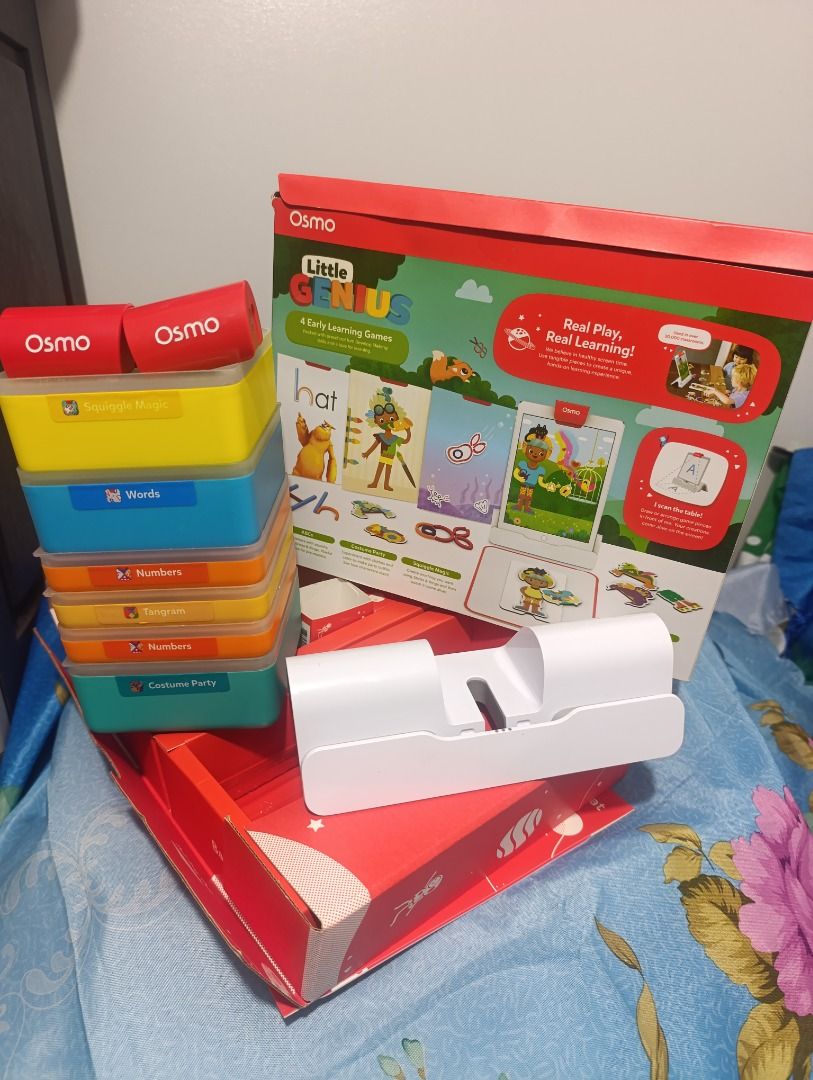 Osmo Little Genius Starter Kit for iPad (Category: Educational & Learning Toys) located in Cebu City. Submitted by kaiser.532 (Listing ID 1470444562, Image 3). Description: - Osmo Little Genius Starter Kit for iPad - Condition: Box opened to check contents only, all pieces neatly packed inside original red packaging - Includes: Base, red reflector, silicone sticks and rings, costume pieces, silicone play mat, and stackable storage boxes - Feature