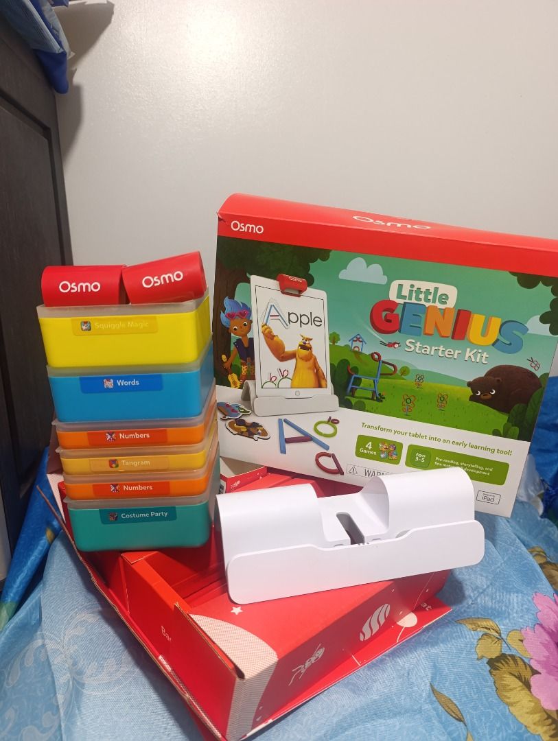 Osmo Little Genius Starter Kit for iPad (Category: Educational & Learning Toys) located in Cebu City. Submitted by kaiser.532 (Listing ID 1470444562, Image 2). Description: - Osmo Little Genius Starter Kit for iPad - Condition: Box opened to check contents only, all pieces neatly packed inside original red packaging - Includes: Base, red reflector, silicone sticks and rings, costume pieces, silicone play mat, and stackable storage boxes - Feature