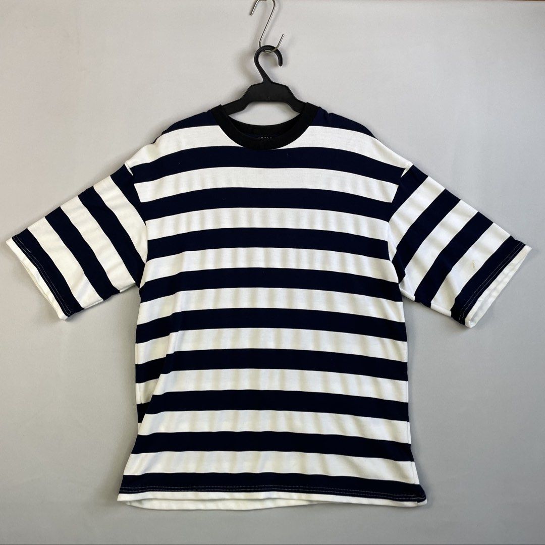 Oversized Horizontal Striped T-Shirt from Gryle Apparel (Category: Tshirts & Polo Shirts ) located in Norzagaray. Submitted by sevenjscloset (Listing ID 1470509749, Image 1). Description: - Brand: Gryle Apparel - Design: Navy and white horizontal stripes (Oversized fit) - Size: Fits Large to XL (Length: 28 inches, Width: 20 inches) - Model Reference: 5'10 and 70kg - Condition: 8.5/10 (No issues).