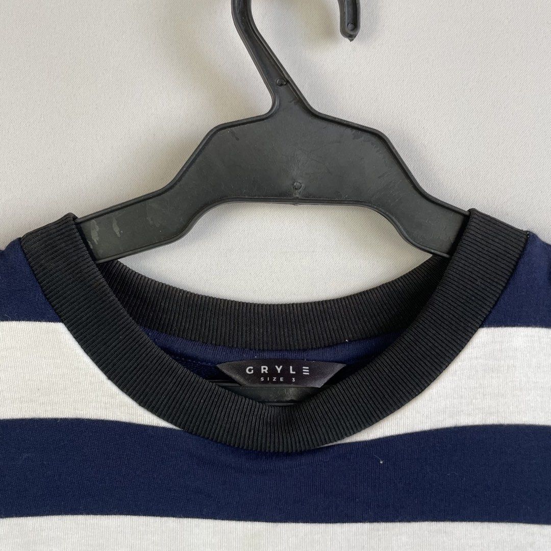 Oversized Horizontal Striped T-Shirt from Gryle Apparel (Category: Tshirts & Polo Shirts ) located in Norzagaray. Submitted by sevenjscloset (Listing ID 1470509749, Image 2). Description: - Brand: Gryle Apparel - Design: Navy and white horizontal stripes (Oversized fit) - Size: Fits Large to XL (Length: 28 inches, Width: 20 inches) - Model Reference: 5'10 and 70kg - Condition: 8.5/10 (No issues).