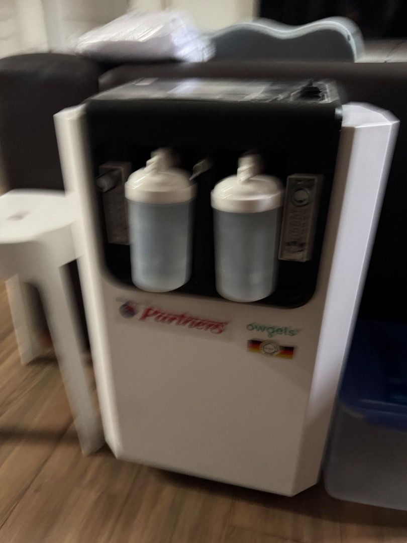 Owgels Oxygen Concentrator 10L Heavy Duty (Category: Medical Supplies & Tools) located in Quezon City. Submitted by roscoe (Listing ID 1470496124, Image 1). Description: - Brand/Model: Owgels Dual Flow Oxygen Concentrator 10L - Color: White and Black - Condition: Powers on with green indicator light, shows standard signs of previous use - Usage: Digital display shows 4,471 total hours - Features: Operational panel for oxygen, exchange, and timer 