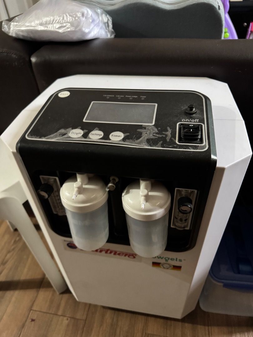 Owgels Oxygen Concentrator 10L Heavy Duty (Category: Medical Supplies & Tools) located in Quezon City. Submitted by roscoe (Listing ID 1470496124, Image 2). Description: - Brand/Model: Owgels Dual Flow Oxygen Concentrator 10L - Color: White and Black - Condition: Powers on with green indicator light, shows standard signs of previous use - Usage: Digital display shows 4,471 total hours - Features: Operational panel for oxygen, exchange, and timer 