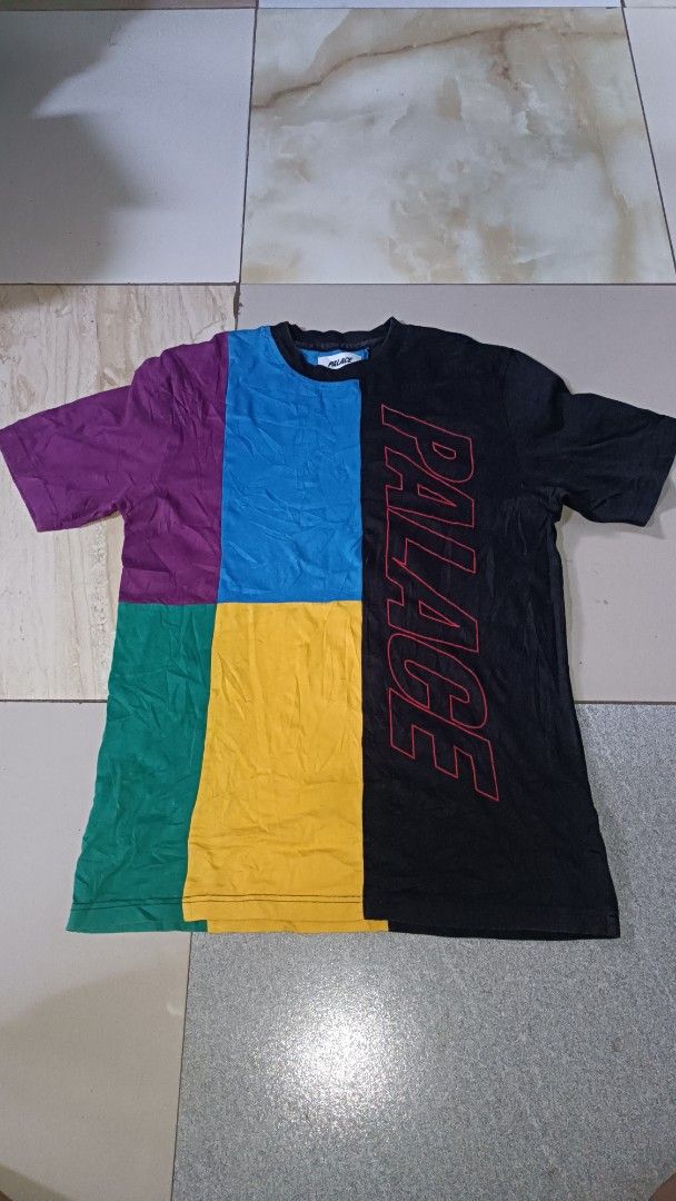 Palace Multi Color Split T-Shirt (Category: Tshirts & Polo Shirts ) located in Davao. Submitted by reythriftedclothing (Listing ID 1470448725, Image 1). Description: - Brand: Palace Skateboards - Design: Colour block panels (purple, blue, green, yellow, black) - Feature: Big red outline logo running do wn the right side - Fit: Standard fit with short sleeves and crew neck - Details: Clean white neck tag with black text - Style: Ultimate streetwea