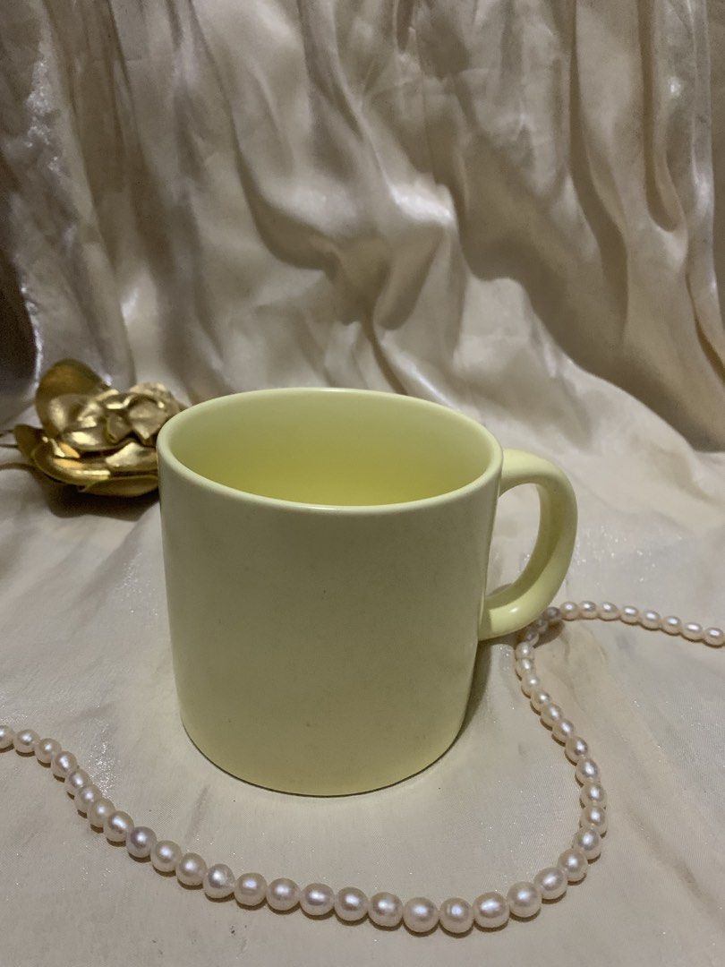 Pale Yellow Ceramic Coffee Mug (Category: Coffee & Tea Tableware) located in Daraga. Submitted by shevvv28 (Listing ID 1470457999, Image 2). Description: - Color: Solid pale yellow - Material: Sturdy ceramic with a modern matte finish - Size: Standard capacity, great for morning coffee or tea - Design: Comfortable curved handle and clean interior - Condition: Excellent, clean, and ready to use.