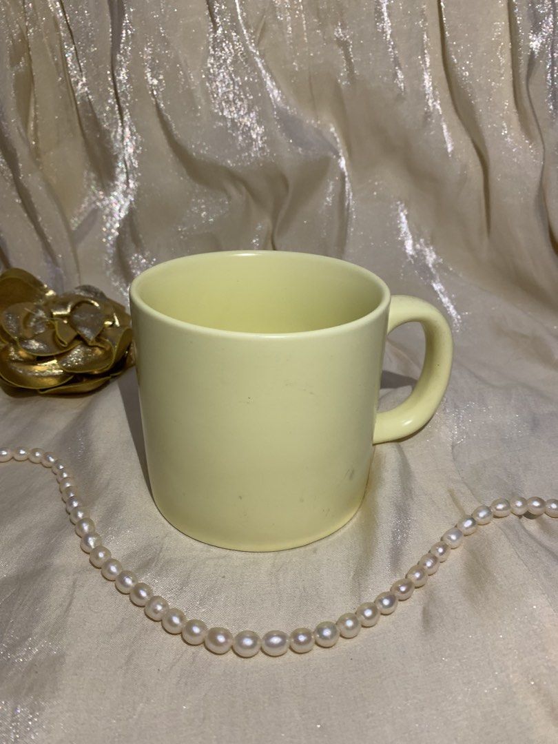 Pale Yellow Ceramic Coffee Mug (Category: Coffee & Tea Tableware) located in Daraga. Submitted by shevvv28 (Listing ID 1470457999, Image 3). Description: - Color: Solid pale yellow - Material: Sturdy ceramic with a modern matte finish - Size: Standard capacity, great for morning coffee or tea - Design: Comfortable curved handle and clean interior - Condition: Excellent, clean, and ready to use.