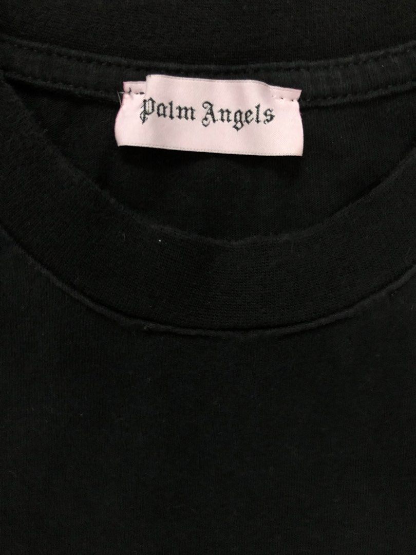 Palm Angels Black Heart Logo Tee (Category: Activewear) located in Manila. Submitted by purewater.2554df (Listing ID 1470500121, Image 2). Description: - Authentic Palm Angels black t-shirt - Regular fit design - Red embroidered heart patch on the left chest - Ribbed collar with signature pink logo neck label - 100% premium cotton fabric, made in Italy - Clean interior wash tags intact - Perfect solid streetwear basic.