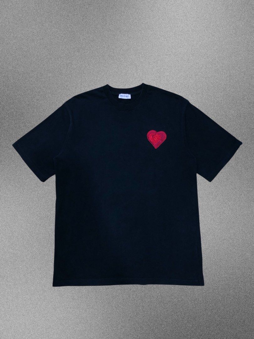 Palm Angels Black Heart Logo Tee (Category: Activewear) located in Manila. Submitted by purewater.2554df (Listing ID 1470500121, Image 1). Description: - Authentic Palm Angels black t-shirt - Regular fit design - Red embroidered heart patch on the left chest - Ribbed collar with signature pink logo neck label - 100% premium cotton fabric, made in Italy - Clean interior wash tags intact - Perfect solid streetwear basic.