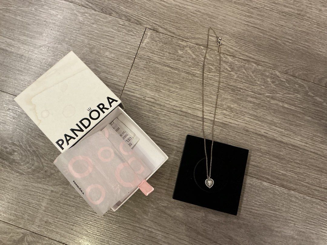 Pandora Sparkling Elevated Heart Necklace with Original Box (Category: Necklaces) located in Manila. Submitted by swifttiger_d1a8c7 (Listing ID 1470468992, Image 2). Description: - Authentic Pandora necklace - Sterling silver chain with sparkling paved heart pendant - Versatile design, easy to match with daily outfits - Includes original white Pandora box, branded tissue paper, and black velvet display insert.